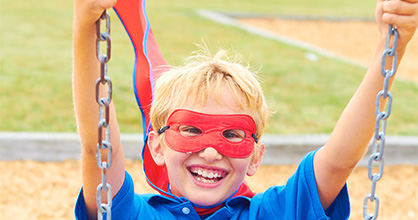 Boy on a swing smiling