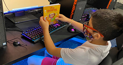 A child competes in the 2020 Battle of the Books online. 